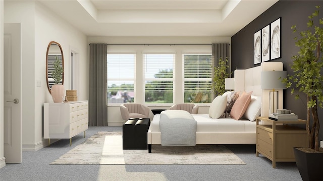 bedroom with multiple windows, a tray ceiling, and light carpet