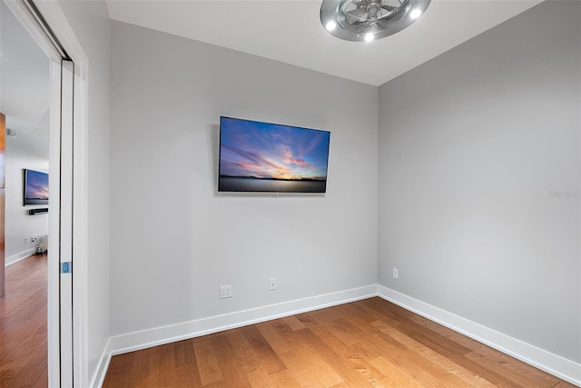 spare room featuring wood-type flooring