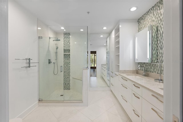 bathroom featuring walk in shower and vanity