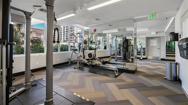 workout area with dark colored carpet