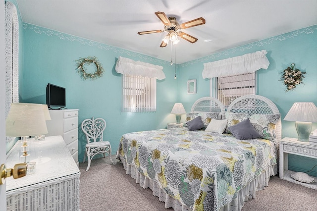 carpeted bedroom with ceiling fan