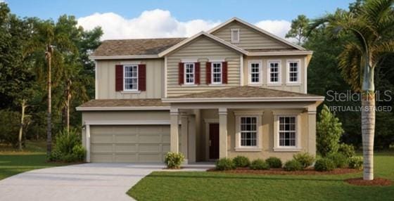 view of front of property featuring a garage and a front yard