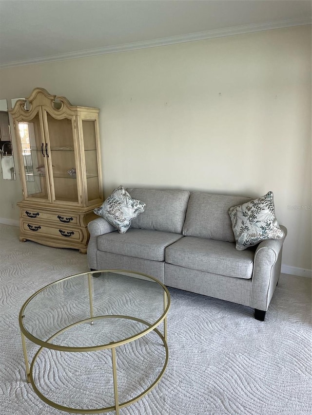 carpeted living room with crown molding