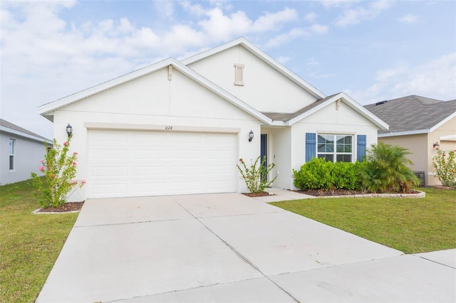 ranch-style home with a garage and a front lawn