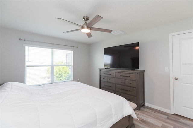 bedroom with ceiling fan and light wood-type flooring