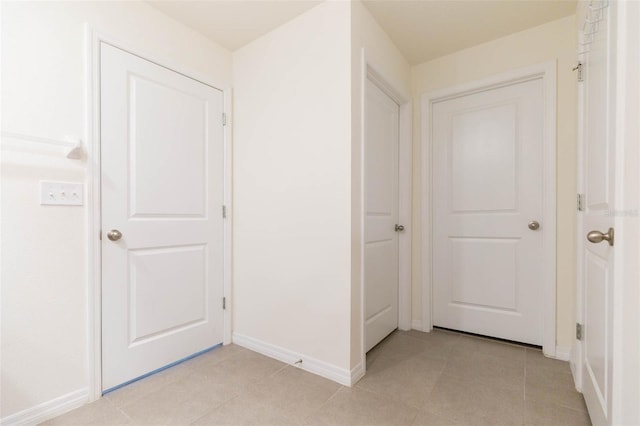 hallway with light tile patterned floors