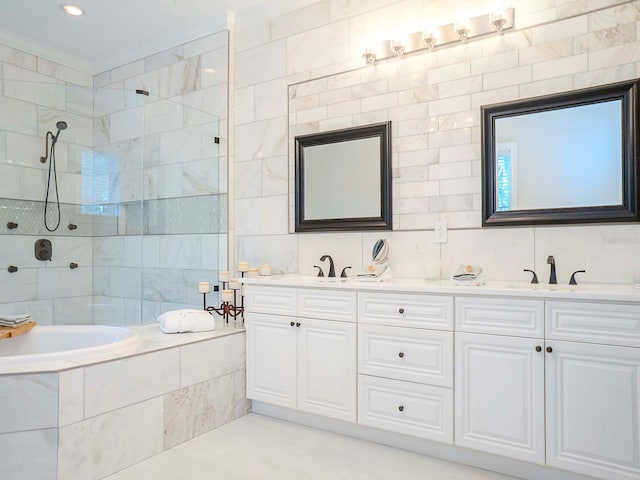 bathroom with vanity, tile walls, and separate shower and tub