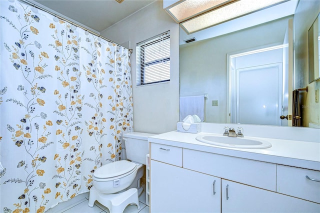 bathroom featuring vanity and toilet