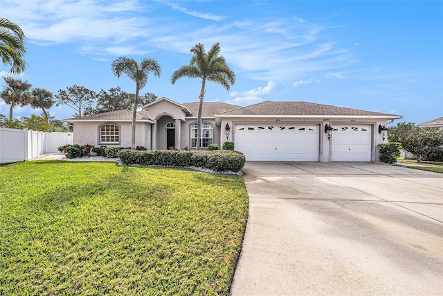 single story home featuring a garage and a front lawn