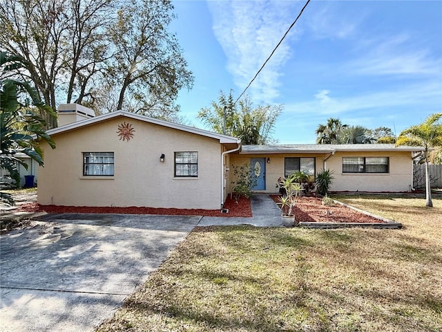 ranch-style house with a front yard