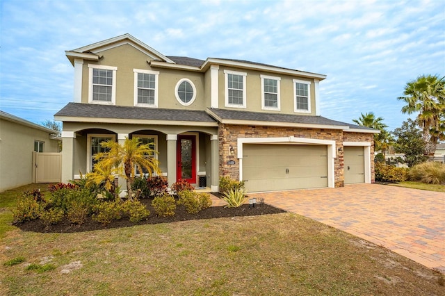 view of front of home featuring a garage and a front lawn