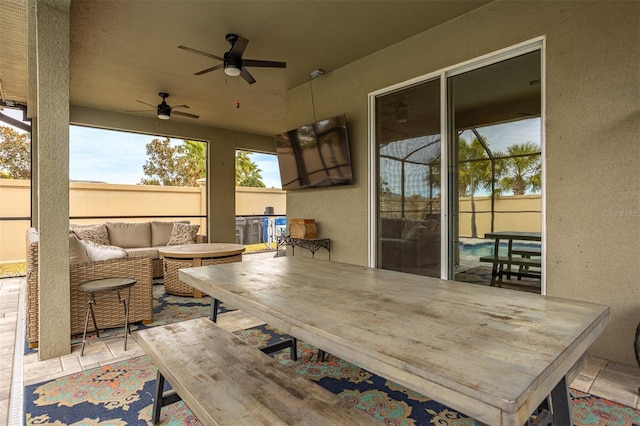 view of patio featuring an outdoor hangout area and ceiling fan