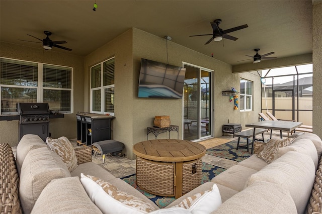 view of patio / terrace with ceiling fan, grilling area, and outdoor lounge area