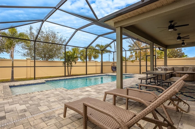 view of swimming pool with a lanai, outdoor lounge area, a patio, and ceiling fan