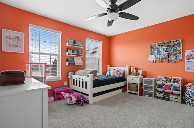 bedroom with ceiling fan and carpet flooring