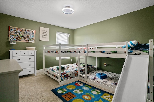 carpeted bedroom with a textured ceiling