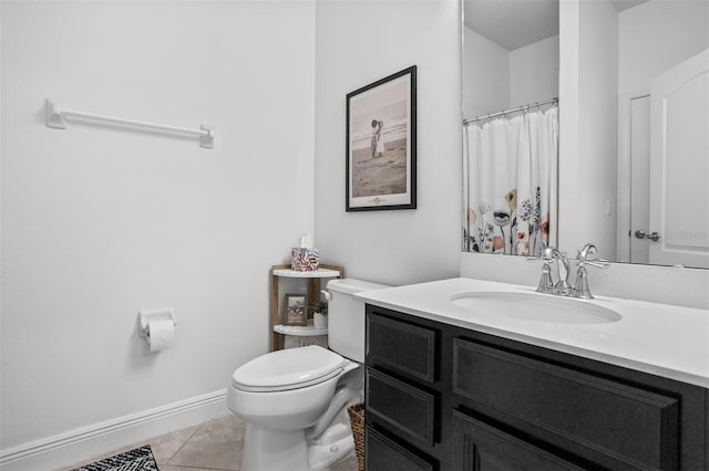 bathroom featuring vanity, tile patterned floors, toilet, and walk in shower