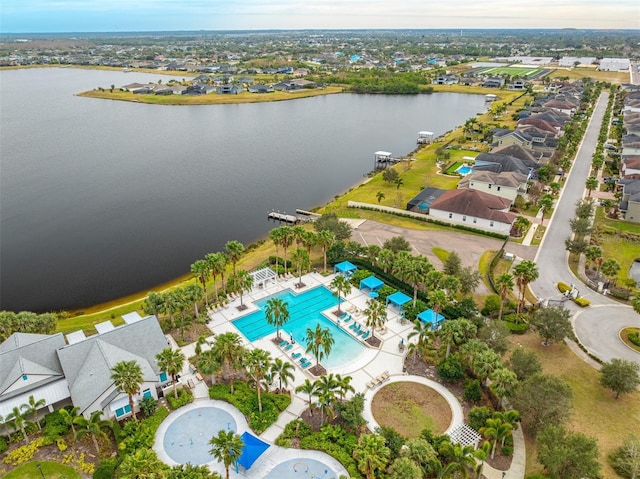 birds eye view of property with a water view