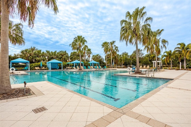 view of swimming pool featuring a gazebo and a patio area