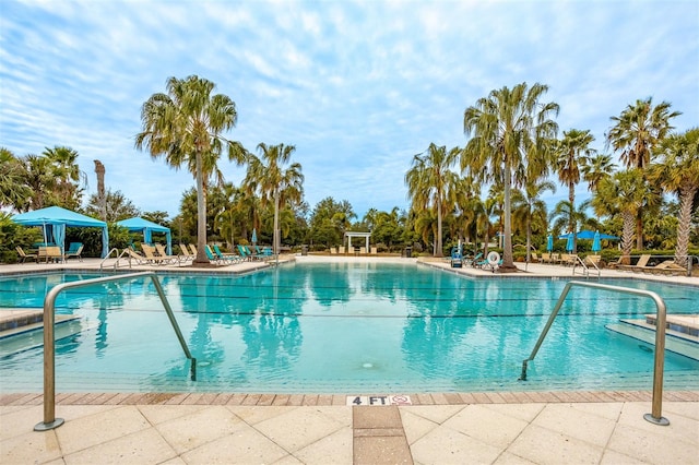 view of pool featuring a gazebo and a patio