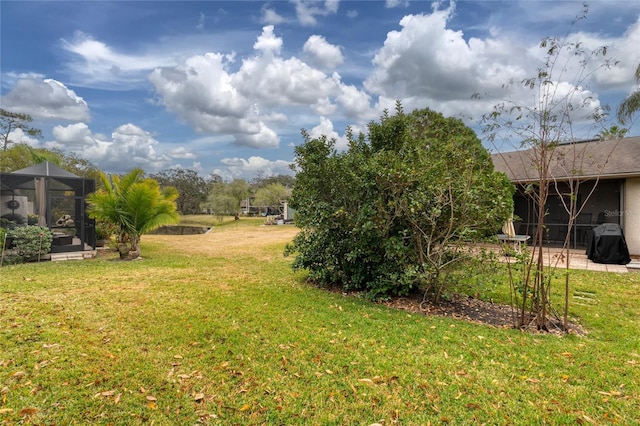 view of yard featuring a lanai