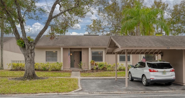 20 Sylvia Pl, Oldsmar, FL 34677 - ranch-style home featuring a shingled roof and a front lawn