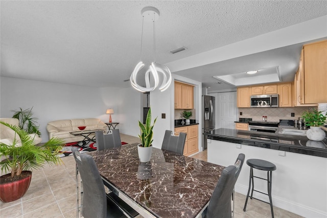 20 Sylvia Pl, Oldsmar, FL 34677 - dining area with a raised ceiling