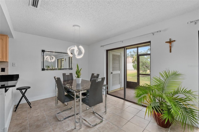 20 Sylvia Pl, Oldsmar, FL 34677 - dining room with a textured ceiling, light tile patterned floors, a chandelier, and baseboards