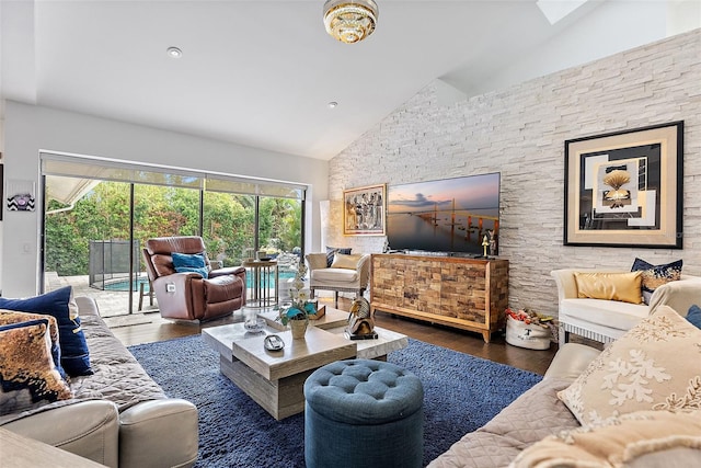 living room with high vaulted ceiling and dark hardwood / wood-style flooring