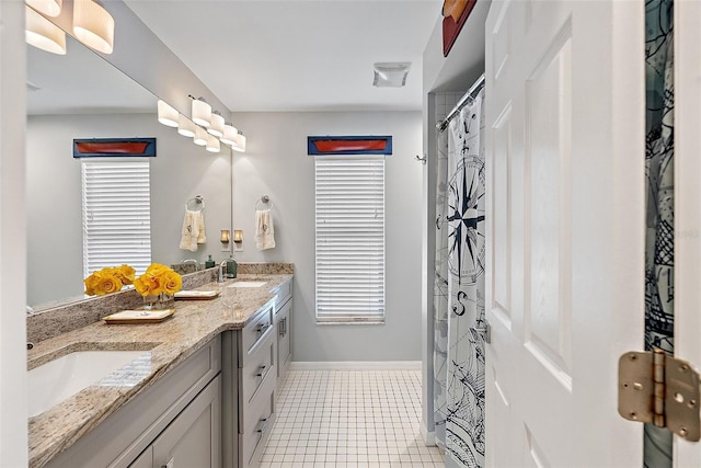 bathroom with vanity and tile patterned floors