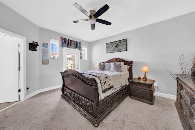 bedroom with ceiling fan and light colored carpet