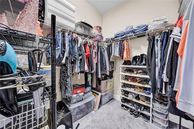 walk in closet featuring carpet