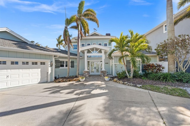 view of front of property featuring french doors and a garage