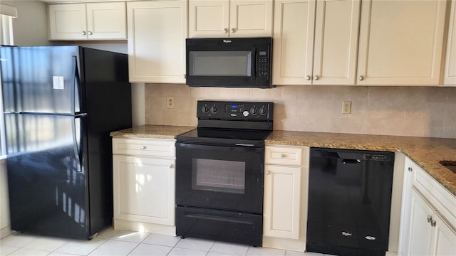 kitchen with backsplash, dark stone counters, light tile patterned flooring, and black appliances