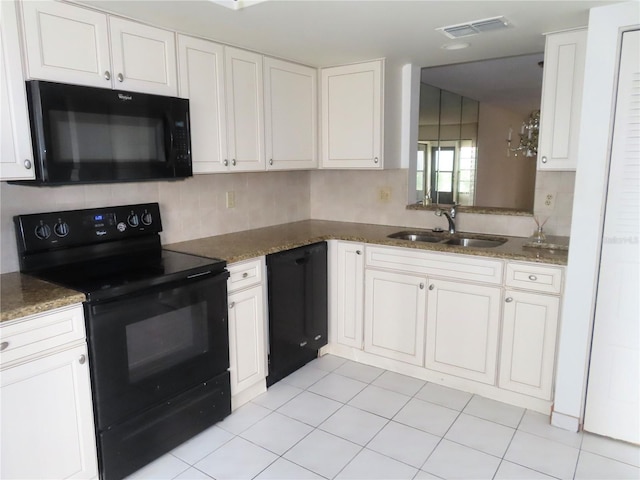 kitchen featuring sink, white cabinets, and black appliances