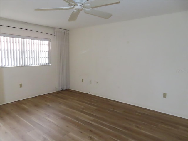 empty room featuring wood-type flooring and ceiling fan