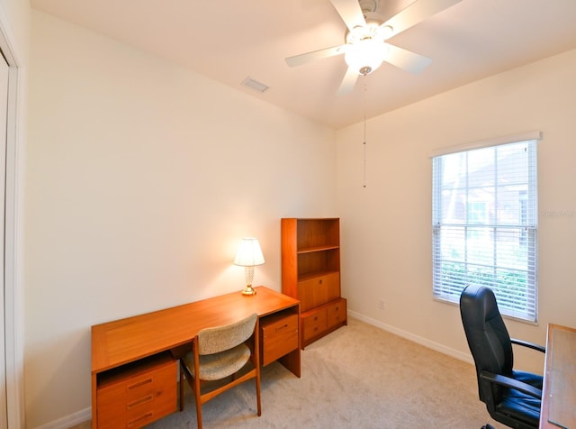 office area featuring light colored carpet and ceiling fan