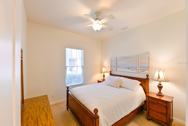 bedroom featuring ceiling fan and light colored carpet