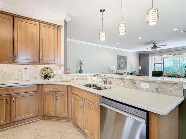 kitchen featuring crown molding, stainless steel dishwasher, sink, and hanging light fixtures