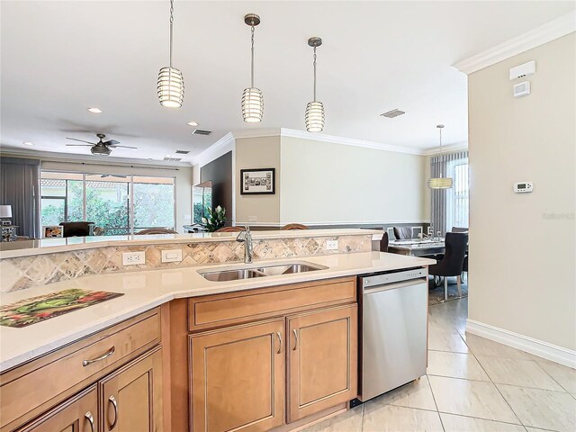 kitchen featuring sink, crown molding, hanging light fixtures, and dishwasher