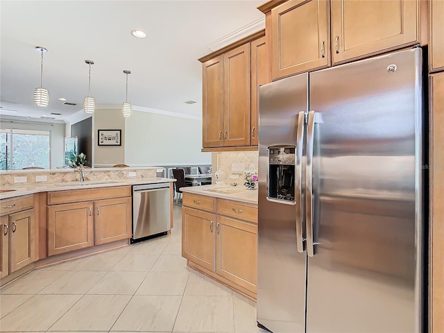 kitchen with sink, crown molding, tasteful backsplash, decorative light fixtures, and appliances with stainless steel finishes