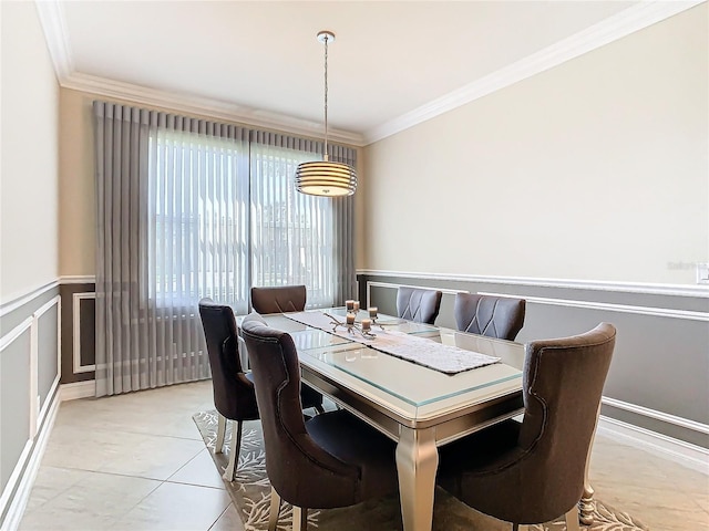 dining space with crown molding and light tile patterned floors