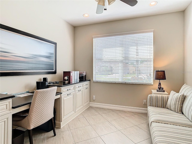 tiled home office featuring ceiling fan