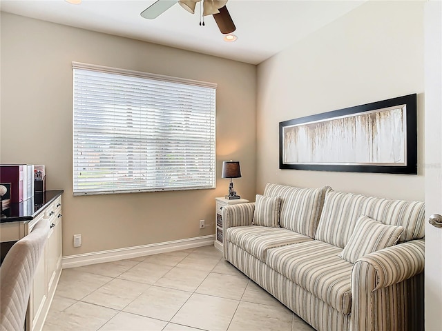 living room featuring light tile patterned floors and ceiling fan