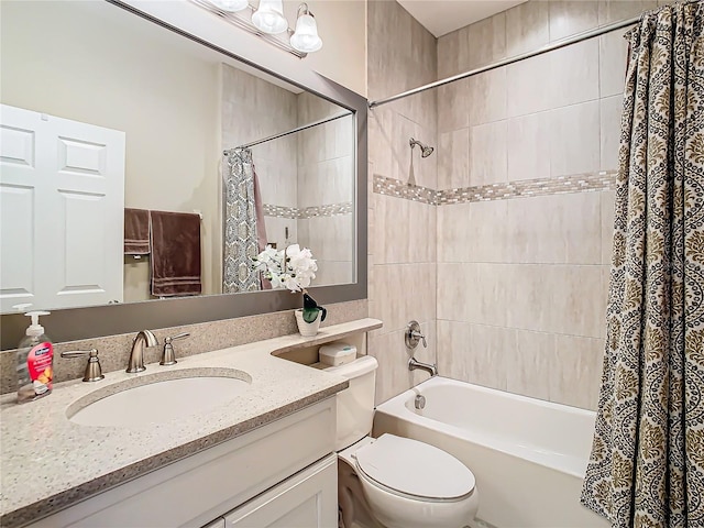 full bathroom featuring shower / tub combo with curtain, vanity, and toilet