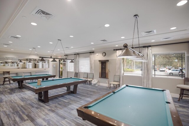 recreation room with crown molding, billiards, and wood-type flooring