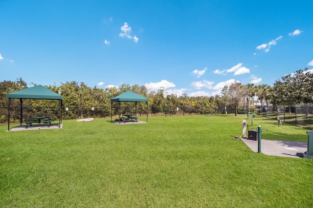 surrounding community with a gazebo and a lawn