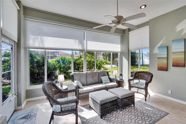 sunroom featuring ceiling fan