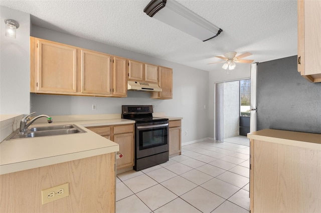 kitchen featuring light tile patterned flooring, appliances with stainless steel finishes, sink, ceiling fan, and light brown cabinets