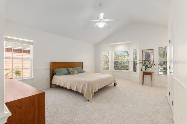 carpeted bedroom with high vaulted ceiling and ceiling fan